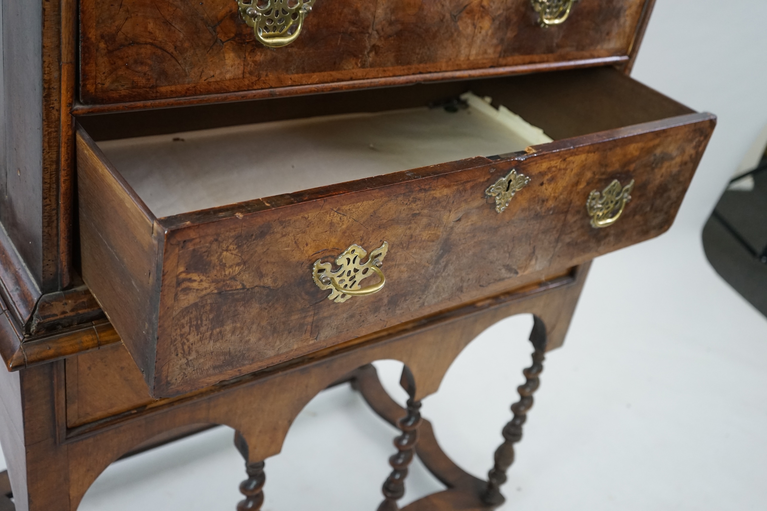 An early 18th century walnut chest on stand